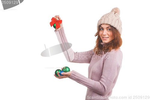 Image of Young woman with christmas ball