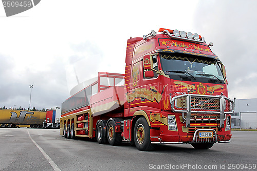Image of Red Volvo FH with Special Trailer