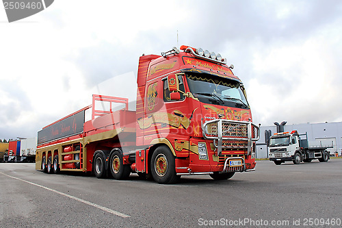 Image of Red Volvo FH with Special Trailer