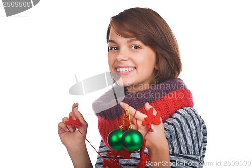 Image of Young woman with christmas ball