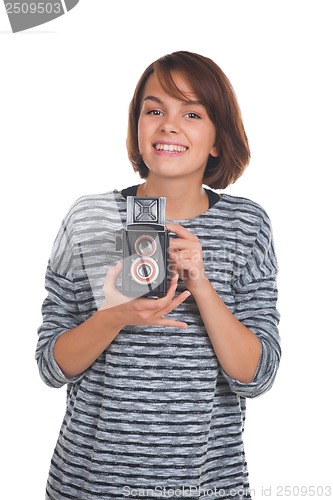 Image of Lovely teenage girl with retro photo camera