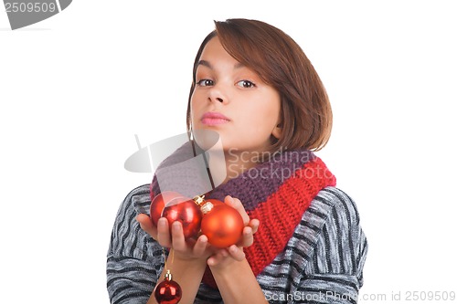 Image of Young woman with christmas ball