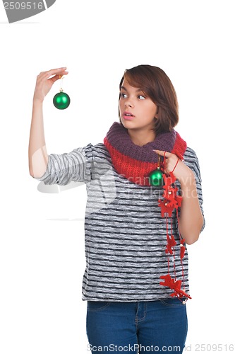 Image of Young woman with christmas ball