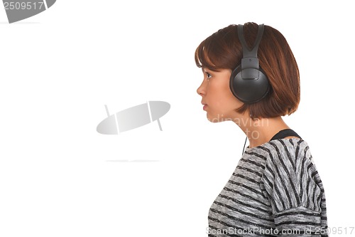 Image of Pretty young girl listening music