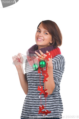 Image of Young woman with christmas ball