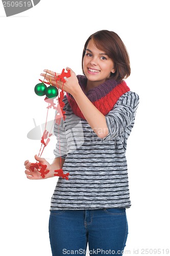 Image of Young woman with christmas ball