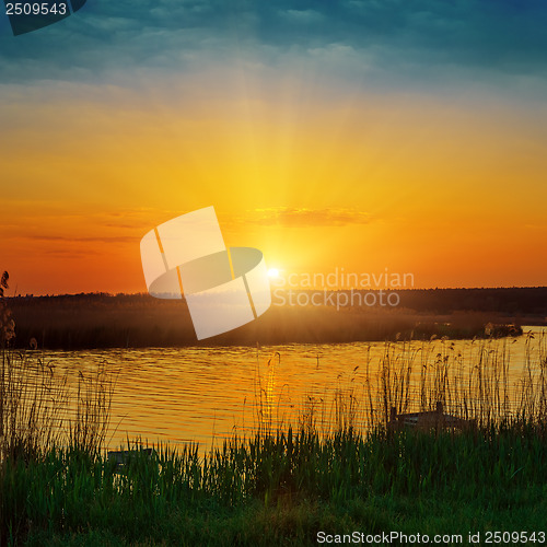 Image of orange sunset over river