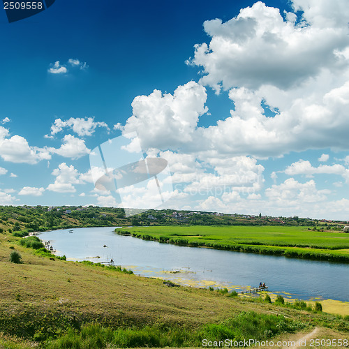 Image of clouds on blue sky over river