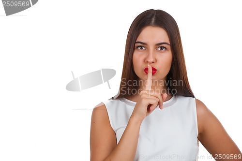Image of Portrait of beautiful woman making a hush gesture