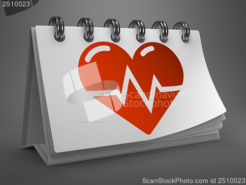 Image of Desktop Calendar with Icon of Heart Cardiogram.