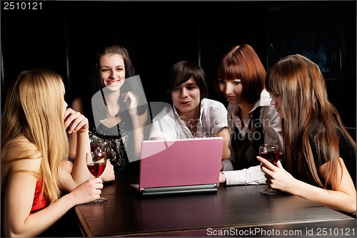 Image of Group young people with laptop in cafe