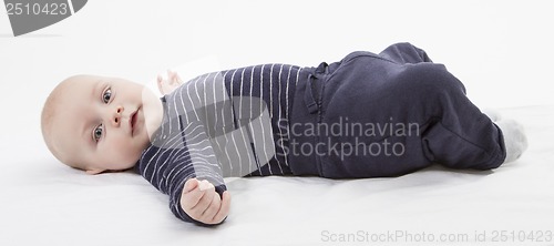 Image of smiling toddler lazing around