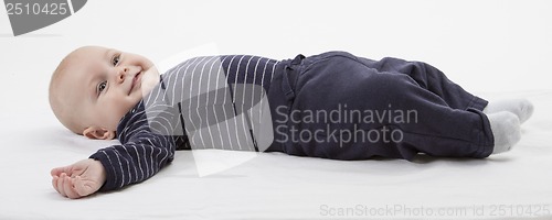 Image of smiling toddler lazing around