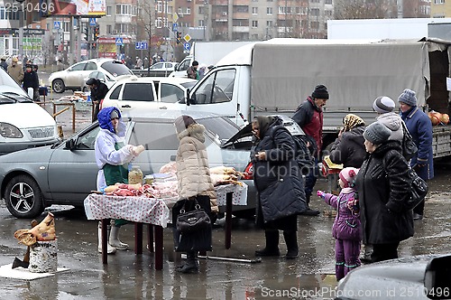 Image of Agricultural fair. Trade in meat on the street.