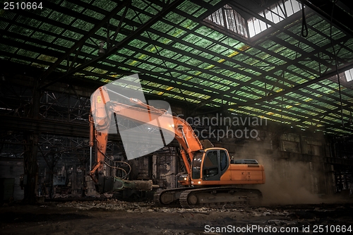 Image of Industrial interior with bulldozer inside