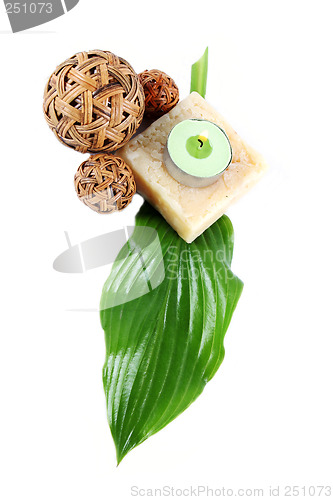 Image of Green leaf, soap and candle