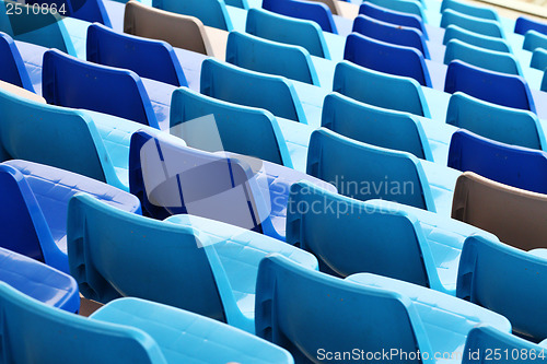 Image of Blue plastic seat in stadium