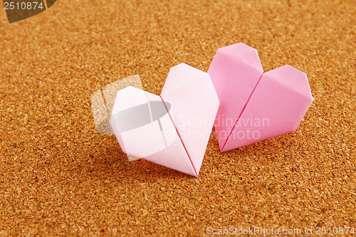 Image of Origami colorful heart on corkboard