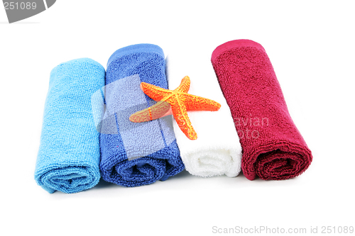 Image of Colorful towels and orange starfish