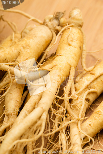 Image of Ginseng with wooden background
