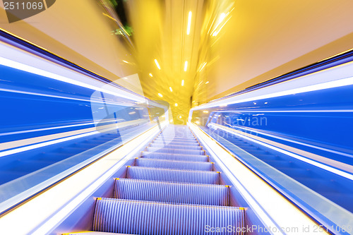 Image of Movement of diminishing hallway escalator