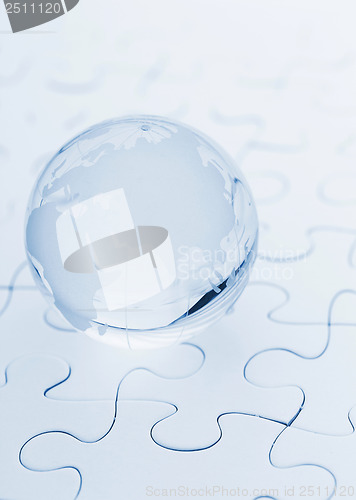 Image of Crystal glass globe ball on puzzle