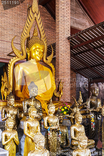 Image of Golden foil on buddha statue in temple