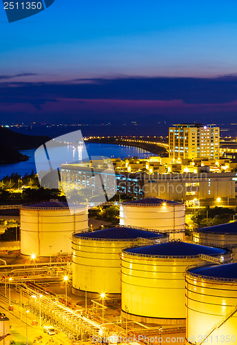 Image of Oil tanks for cargo service at night