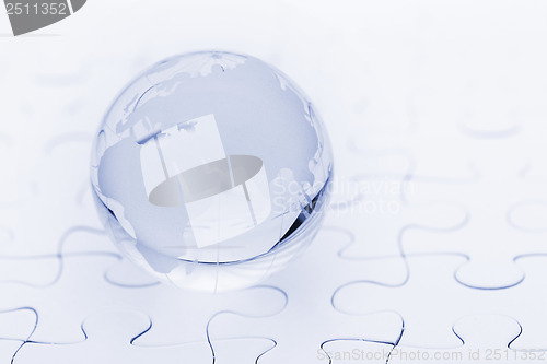 Image of Crystal glass globe ball on puzzle