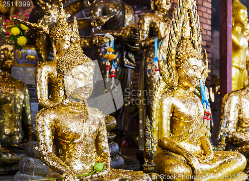 Image of Golden foil on buddha statue