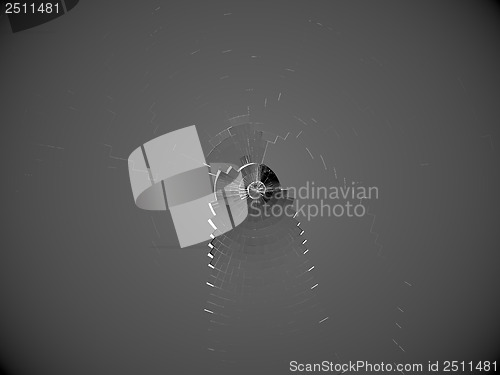 Image of Shattered bulletproof glass with bullet hole