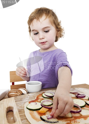 Image of homemade pizza by a cute little girl