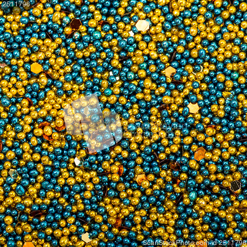 Image of Background from Turquoise and Golden Balls of Bead