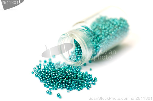 Image of Small Glass Jar filled with Green Balls of Bead
