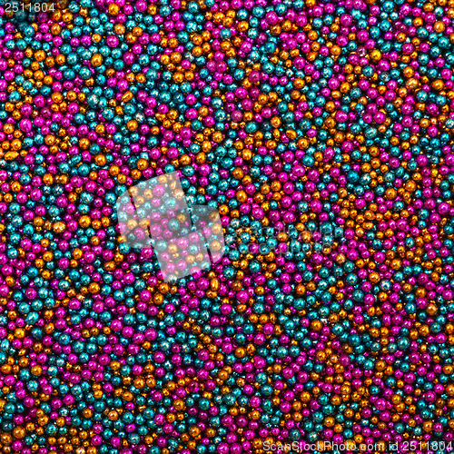 Image of Background from Turquoise, Pink and Golden Balls of Bead