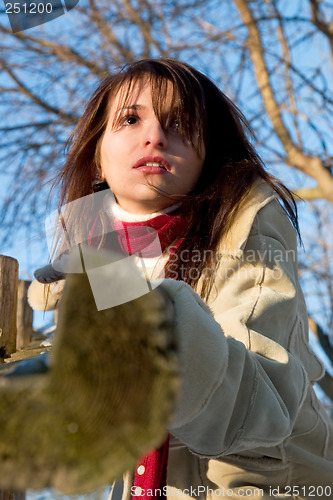 Image of Leaning on a wooden post