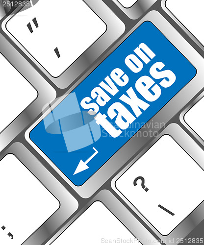 Image of save on taxes word on laptop keyboard key, business concept