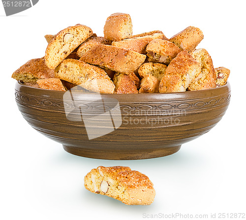 Image of hard, dry biscuit with almonds in a rural clay plate