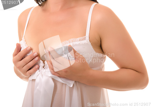 Image of woman examining breast mastopathy or cancer