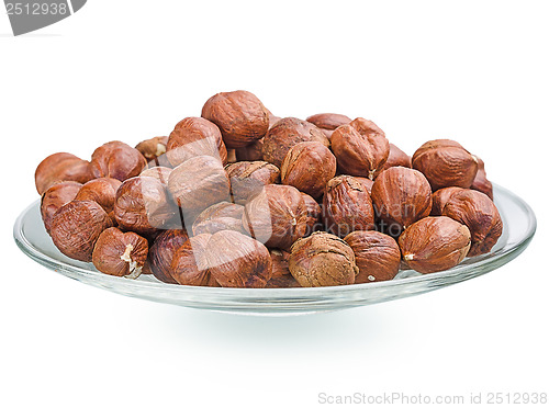 Image of A pile of shell-less hazelnuts, isolated on white background