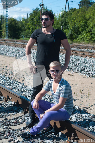 Image of Two men on train tracks