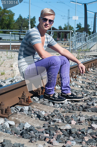 Image of One man on train tracks