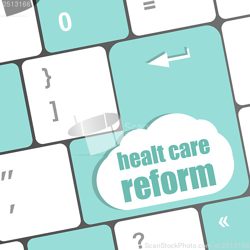 Image of cloud icon with health care reform word on computer keyboard key