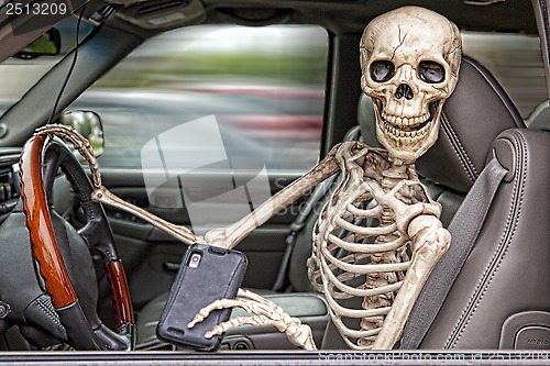 Image of Skeleton Texting and Driving