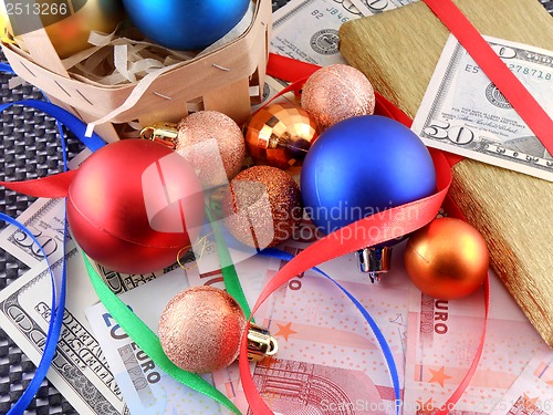 Image of Christmas gift box with christmas balls and money
