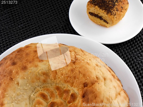 Image of cake and bread on white plate