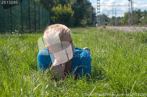 Image of Man lying in a grass