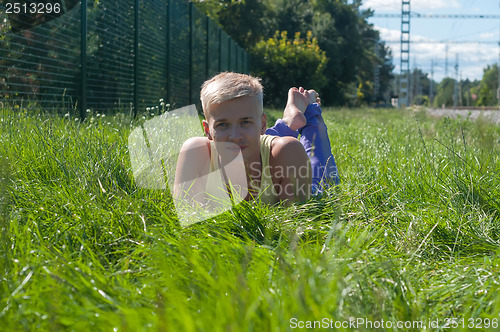 Image of Man lying in a grass