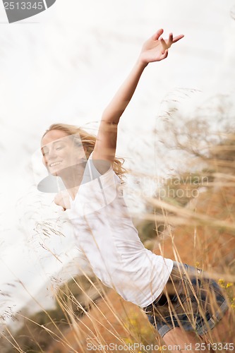 Image of young happy attractive woman arms wide open 