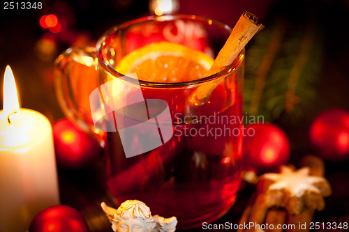 Image of hot tasty spicy mulled red wine with orange and cinnamon christmas 